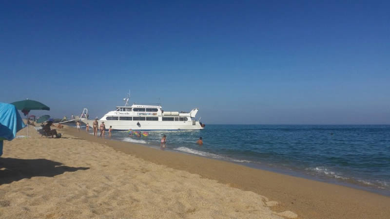 Davide motor ship boarding passengers in Orosei